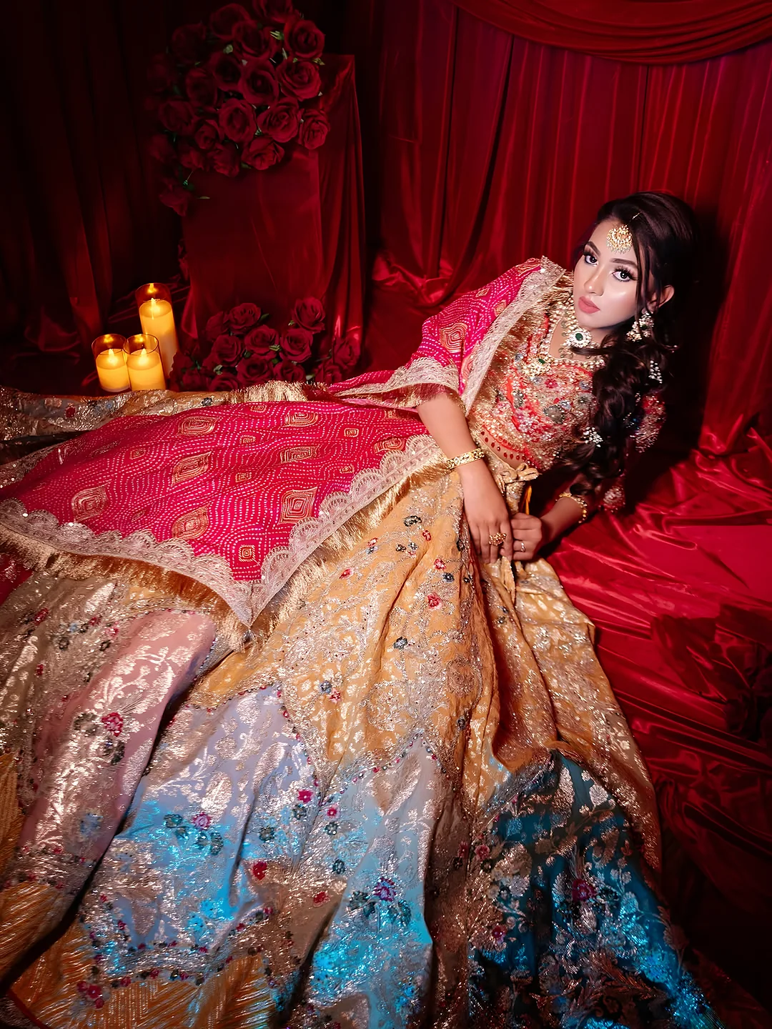 Bride resting in a red lehenga