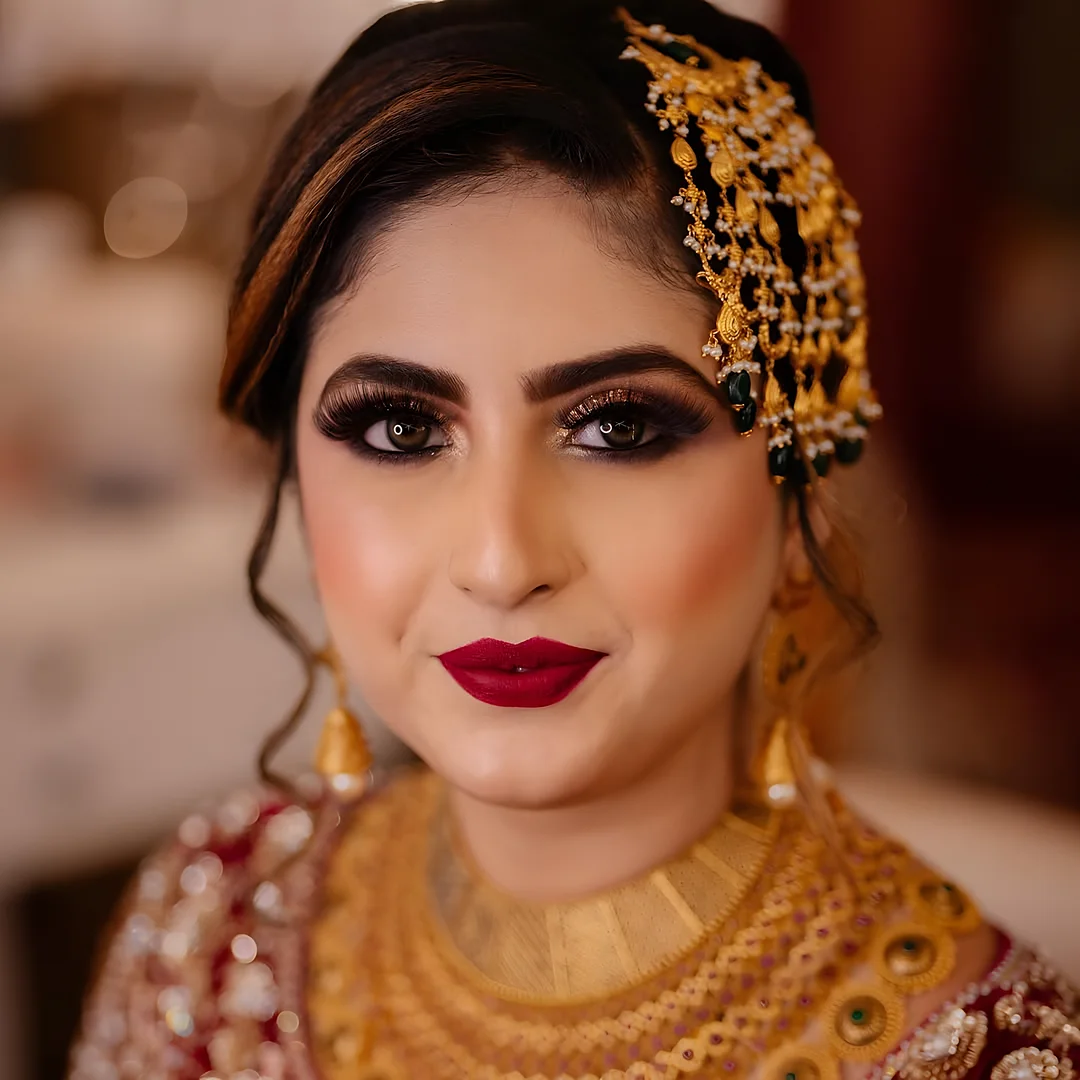 Bridal close-up with a red lip and gold jewellery